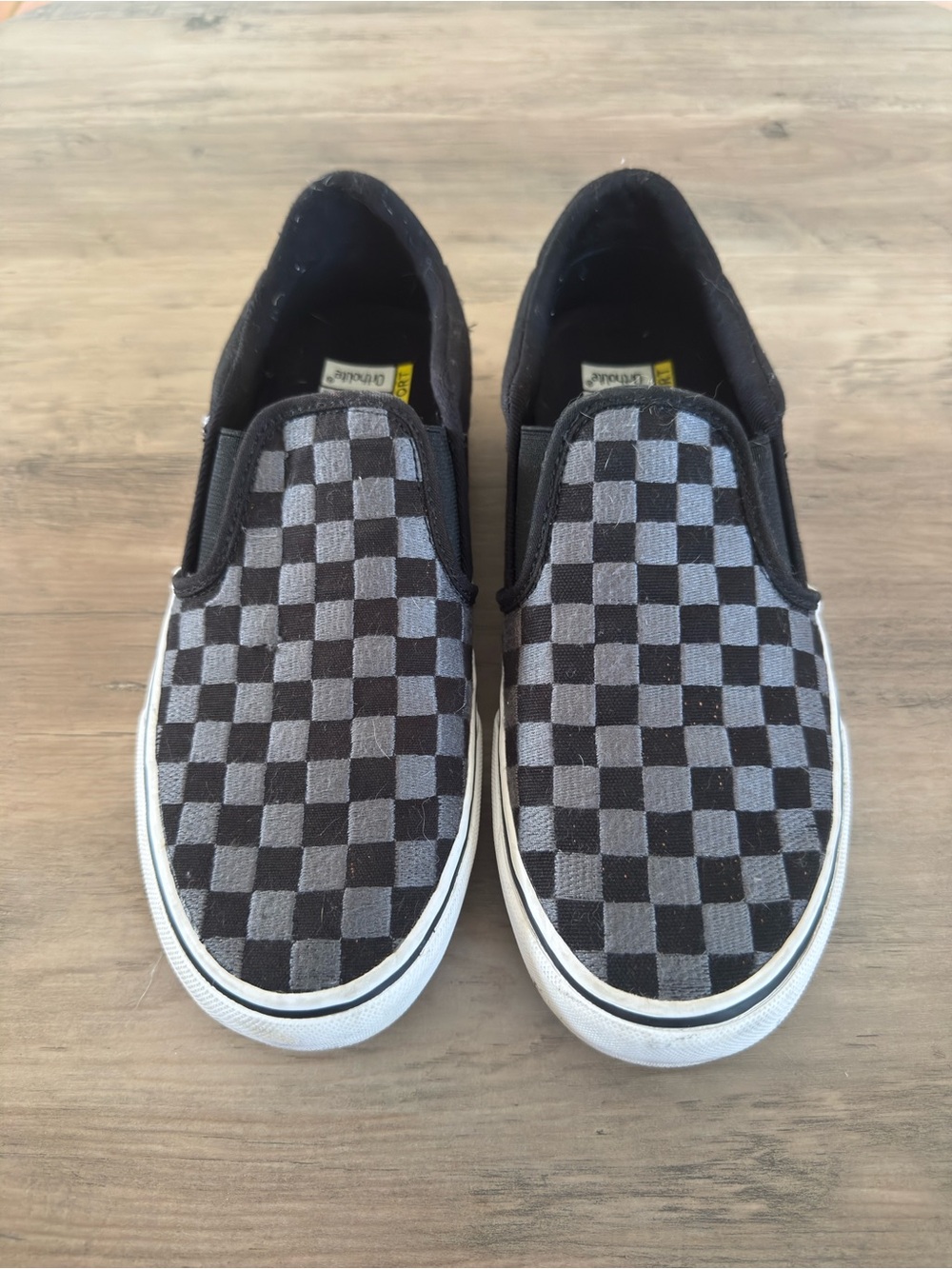 Vans Orthrolite Deluxe Comfort Black and Gray Checkerboard Slip-On Sneakers.